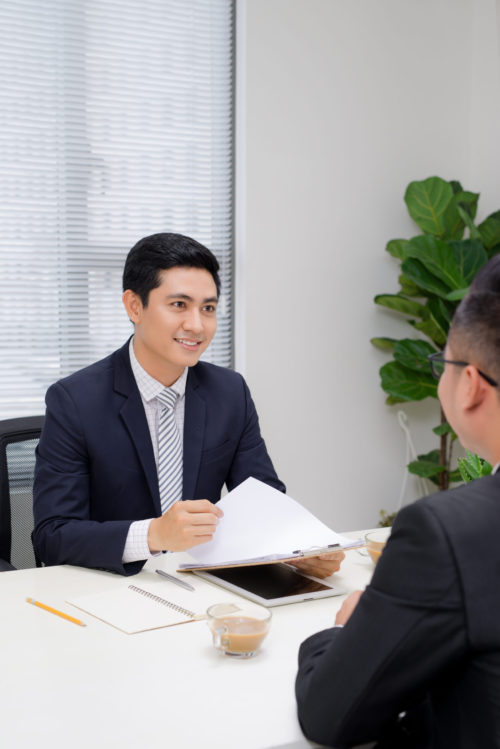 Job interview of two business professionals. Greeting new colleague